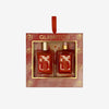 Glampton Caramel Rouge 2-piece gift set featuring a Shimmer Fragrance Mist and a Shimmering Body Oil in a red box with caramel illustrations and a ribbon handle.