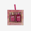 Glampton Crushed Cherry 2-piece set featuring a Shimmer Fragrance Mist and a Shimmering Body Oil in a pink gift box with a ribbon handle.