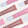 Patterned layout of Glampton Pout Perfect Hydrating Peptide Lip Treatment tubes in Latte and Watermelon shades arranged on a soft gradient background.