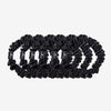 Set of black hair scrunchies on a white background