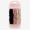 Glampton set of six satin scrunchies in black, pink, and cream tones displayed on branded card packaging against a light background.
