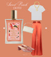 Fashion-style layout with a white T-shirt, layered gold necklaces, peach satin trousers, a cream handbag, peach velvet heels, and a bottle of Glampton Sweet Peach Shimmer Fragrance Mist on a peach-toned background.