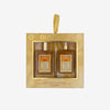 Glampton Vanilla Sun Musk 2-piece gift set featuring a Shimmer Fragrance Mist and a Shimmering Body Oil in a gold box with sunburst accents and a ribbon handle.